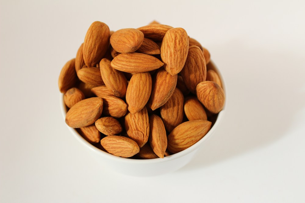Bowl of almonds on a light table